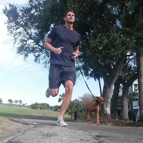 man-with-a-dog-running
